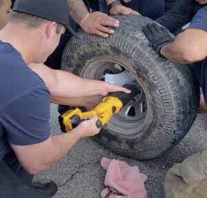 Someone came to get out from the wheel the tiny puppy that was stuck.