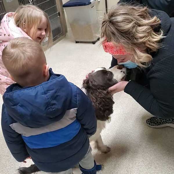 Happy dog reuniting with his loving family