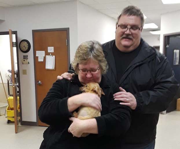 Rescue pup with his new adoptive family