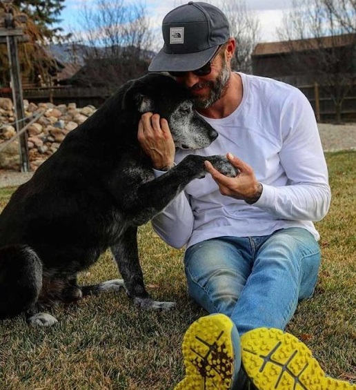 Old dog with his new owner 