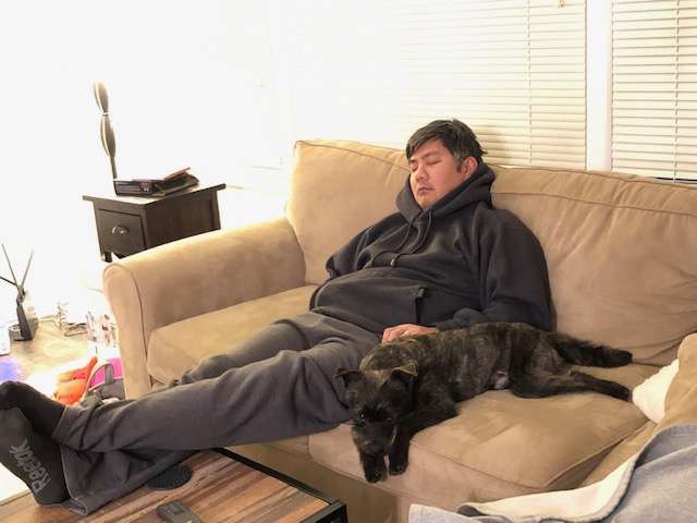 Dog and owner sleeping 