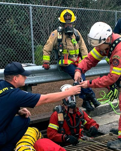 Firefighters rescuing a dog 