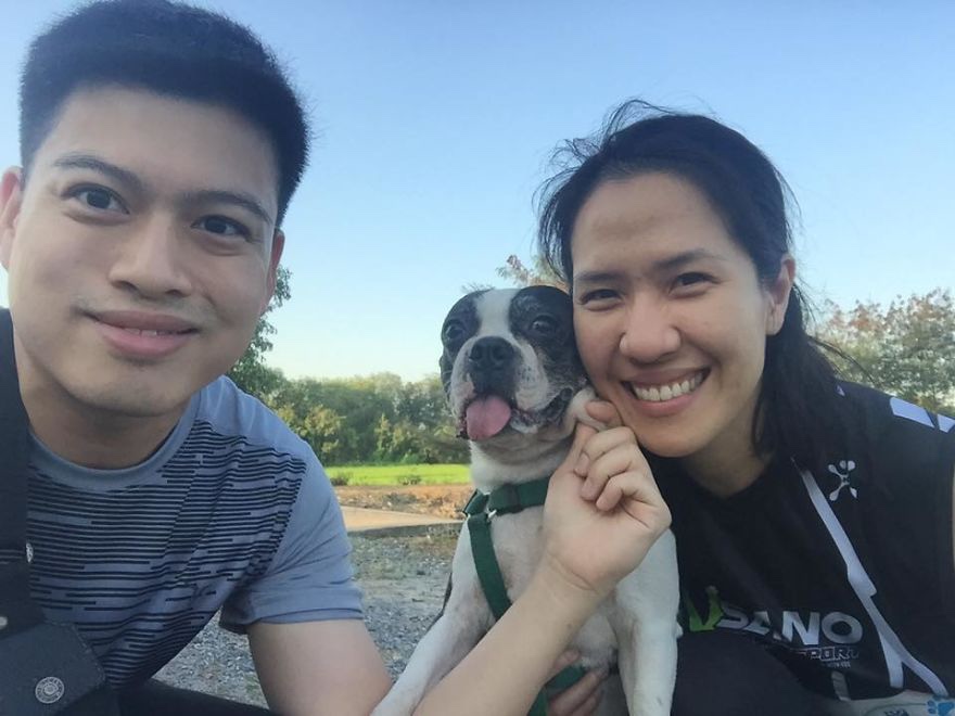 happy couple with their adopted dog