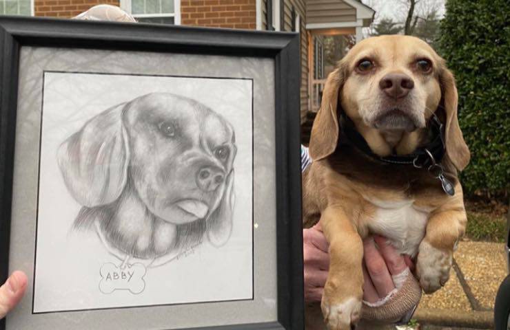 Rescued dog with her portrait 